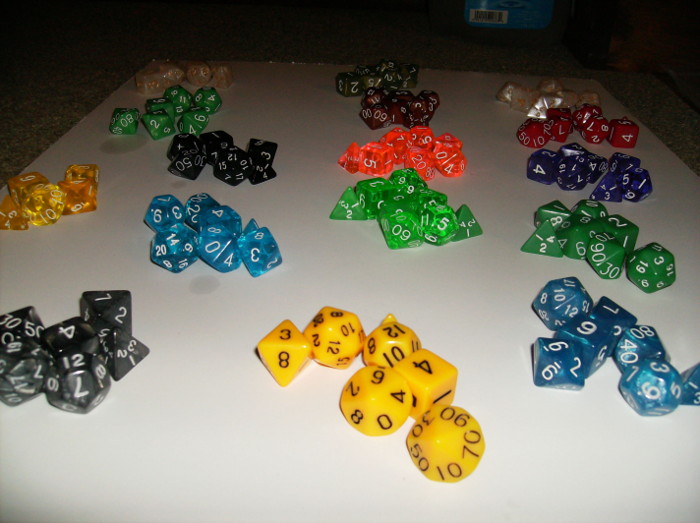 Different sets of dice laid out on floor